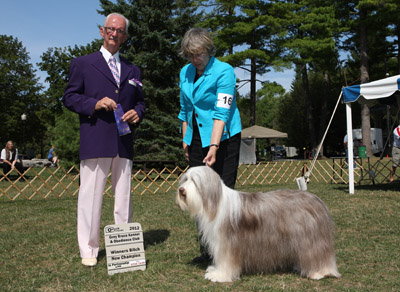 Briana is now a Champion. Here she is with the Judge and her mommy